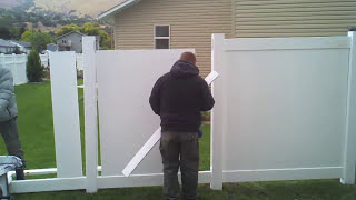 HOW TO INSTALL A VINYL FENCE INSTALLING VINYL FENCE PANELS [upl. by Schreck157]