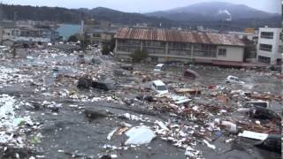 Tsunami in Kesennuma city ascending the Okawa river [upl. by Camilla661]