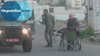 Israeli policeman pushes Palestinian out of wheelchair [upl. by Bud140]