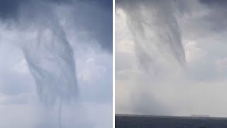 Man Captures Massive MultipleVortex Waterspout [upl. by Belamy]