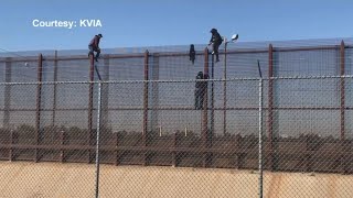 Video shows people climbing fence at border [upl. by Eerol]