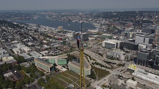 Space Needle Panocam installation shows worker atop spire of Seattle landmark [upl. by Ahsiekan810]