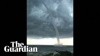 Large waterspout forms as New Orleans inundated with flooding [upl. by Swinton]